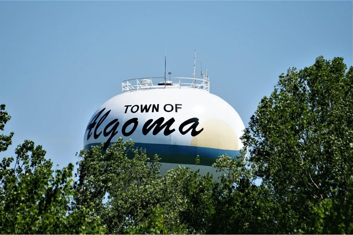 Town of Algoma water tower surrounded by trees