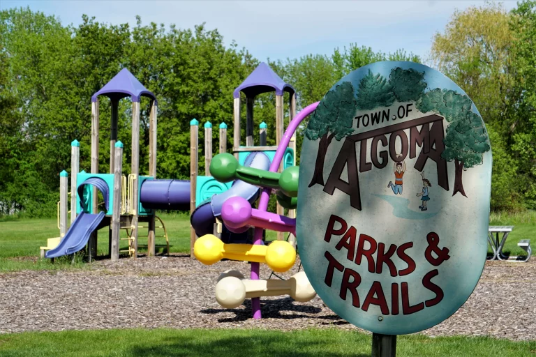 Town of Algoma parks and trails sign with Kewaunee Park playground in the background