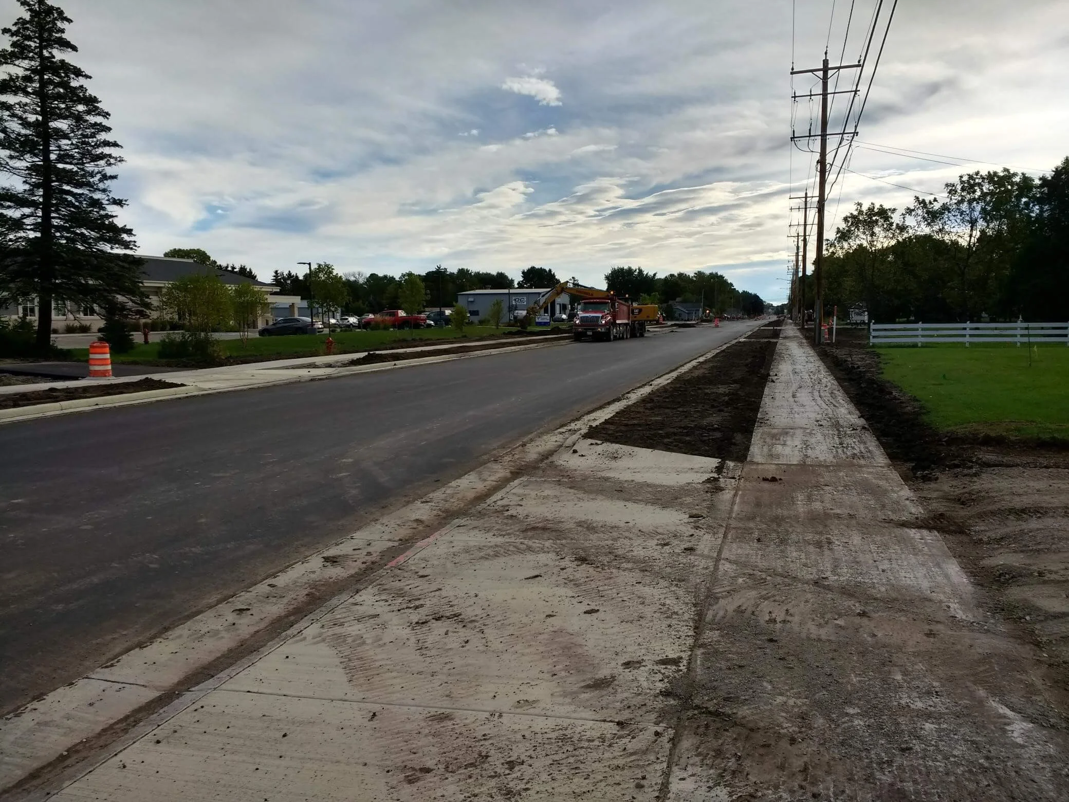 Dirt covers sidewalks undergoing construction
